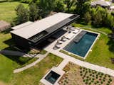 Aerial shot of pool house, pool, and hot tub