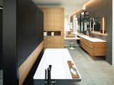 Master bathroom, view of vanity with bathtub and privacy screen in foreground