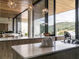 Kitchen, Engineered Quartz Counter, and Wood Cabinet Kitchen  Photo 20 of 30 in Entremuros House by BASSICO ARQUITECTOS