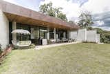 Exterior, Metal Roof Material, House Building Type, Stone Siding Material, and Flat RoofLine Fachada  Photo 9 of 30 in Entremuros House by BASSICO ARQUITECTOS