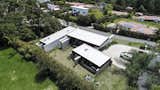 Exterior, Stone Siding Material, House Building Type, Flat RoofLine, and Metal Roof Material Aerial  Photo 4 of 30 in Entremuros House by BASSICO ARQUITECTOS