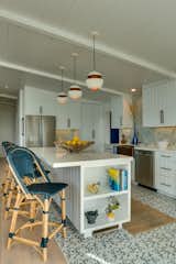 7ft Kitchen Island with built in shelves, white quartz counter tops.  Serena & Lily Riviera counter bar stools, "Here Comes the Sun" pendant lights, Bosch appliances, Lafayette ceramic tile flooring. 
