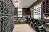 We made a cable racked wine room where a previous bathroom and closet were located.