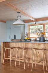 Kitchen, Wood Cabinet, Pendant Lighting, and Quartzite Counter Reclaimed elm Kitchen Island with Article counter stools  Photo 9 of 38 in Sweetwater Cottage by PLACE INTERIORS