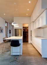 Kitchen, Engineered Quartz Counter, White Cabinet, and Concrete Floor Kitchen 2  Photo 14 of 33 in Oleksiuk Residence by Maple Pike Studio