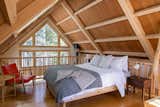 Bedroom, Chair, Bed, and Dark Hardwood Floor Cozy Sleeping loft  Photo 15 of 19 in Shack Up Cabin by Paula Washington