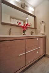 Master bath features Italian vanity with dual sinks and Porcelanosa tile