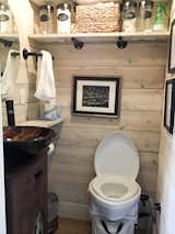 Bath Room, One Piece Toilet, Vessel Sink, Laminate Floor, Wood Counter, and Ceiling Lighting Bathroom with composting toilet  Photo 4 of 10 in Case Rock Cabin by Rachel Evans