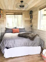 Bedroom, Bed, Laminate Floor, Shelves, and Ceiling Lighting Master Bedroom  Photo 6 of 10 in Case Rock Cabin by Rachel Evans