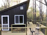 Exterior, Metal Roof Material, Tiny Home Building Type, Flat RoofLine, and Metal Siding Material Outdoors with massive deck  Photo 8 of 10 in Case Rock Cabin by Rachel Evans