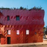 Doors, Metal, Exterior, and Folding The shiny finishing of the crimson red facade reflects the sky appearing blue as one approaches the building and looks at it from below.
  Doors Folding Photos from The Seed of Time