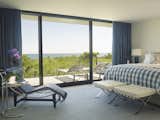 Bedroom, Night Stands, Chair, Bed, Table Lighting, and Ceramic Tile Floor The Master Bedroom with expansive views to the Ocean.  Photo 8 of 10 in Mid-Century Modern by Austin Patterson Disston Architects