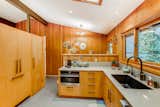 kitchen pantry at left original but refrigerator/freezer next to it was built to fit in as much as possible.