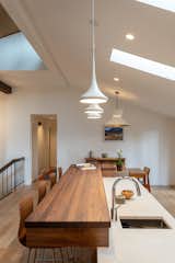 The island with a walnut butcher block bar top was designed to make it easy to socialize while preparing a meal for guests.