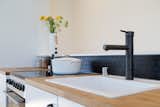Kitchen, White Cabinet, Range, Wood Counter, and Drop In Sink Innovative use of black coin rubber flooring at the backsplash.   Search “가상화폐현금화☾『텔레-coin2002』리플온라인거래소♟™❈비트코인온라인거래소가상화폐온라인거래소√” from The Prospect