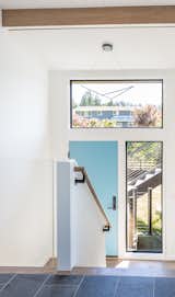 The front and rear entrances are marked with distinctive blue doors.