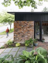 Garage30 with brick wall base and metal roof eave