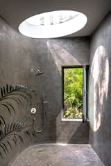 This sunroof, monolithic, bathroom at Lua is a true dream in immersive tropical living. 