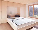 Bedroom, Wardrobe, Bed, Light Hardwood Floor, and Ceiling Lighting Sleeping Room  Photos from Semi detached house on a hillside