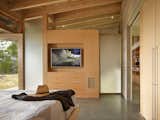 Bedroom, Storage, Bed, Dresser, Concrete Floor, Accent Lighting, Ceiling Lighting, and Wardrobe  Photo 9 of 18 in Suncrest Residence by Heliotrope Architects