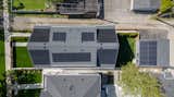 Exterior overhead photograph of solar panels on the roof of this Net Zero duplex and garage