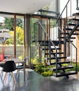 The custom-made steel and Douglas fir staircase leads up to the bedrooms.