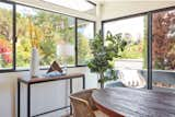 The dining room is flooded with natural light. The couple turned to stager Meredith Baer to outfit the area.