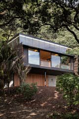 The black, steel-framed residence has a Western red cedar skin brought in from Canada, chosen for its ability to withstand tumultuous environments.