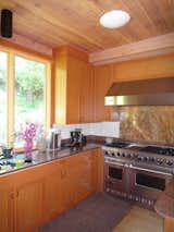 One of the things that was important to the homeowner was updating all the wood. "The wood was all different and after time had yellowed," says Theobald. "We went with white oak and Douglas fir and brought in a finisher to fix some of the existing knots."