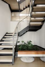 With white oak treads and a steel-and-glass railing, the new staircase is much more elegant.