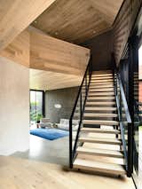 The staircase may just be the most impressive feature as it combines all of the materials in an architectural element that is both sculptural and functional.