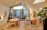 His and Hers House by FMD Architects kitchen and dining room with triangular skylights