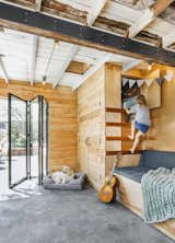 The original run-down shed wasn’t very functional: The roof leaked, the carpet had sprouted mold, and the narrow quarters were sectioned off as two parking spots and two office spaces. So Ella engaged Mutuus Studio to help figure out an optimal design for the 360-square-foot shed—one that would encompass garden shed, exercise room, office, playroom, and outdoor dining space all while staying within a modest budget of less than $40,000.