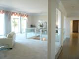 The home was originally purchased through a bankruptcy sale. The first owners, who were new to the Bay Area, had come from New York but were called back to the East Coast, leaving the project halfway finished. Pre-remodel, Feldman jokingly called the living room the "Love Boat" due to the large awkward staircase right in the center.   Photo 5 of 11 in Before & After: A Portola Valley Home Draws Inspiration From Down Under