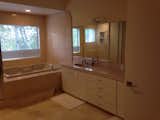 The original bathroom was a 1990s-style disaster with a lack of natural light.   Photo 8 of 11 in Before & After: A Portola Valley Home Draws Inspiration From Down Under
