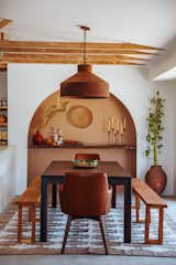 The circular wall sconce is a nod to Ahumada’s Mexican heritage. It’s made from a $2 comal—a type of cookware that is traditionally used to prepare tortillas. “We bought four of them, and they turned out amazing using an LED strip and a cake plate," Thomas says. 