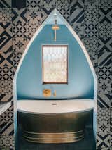 Architectural styles blend in this guest bath painted Eames for Blue by Dunn Edwards.&nbsp;