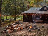 A fire pit and string lights allow for cozy gatherings outside the Highland Bungalow.