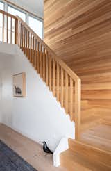 The wooden staircase is a nod to the original timber cabin. 