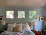 In the bedroom, three small windows directly faced the neighbors. While they did let in light, the homeowner desired a greater sense of privacy.