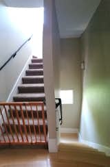 The stairs seemed like an afterthought in the builder-grade home, short on natural light and style.  Photo 10 of 25 in Before & After: She Renovated Her Austin Home With an Unusually Specific Aesthetic