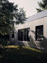 <span style="font-family: Theinhardt, -apple-system, BlinkMacSystemFont, &quot;Segoe UI&quot;, Roboto, Oxygen-Sans, Ubuntu, Cantarell, &quot;Helvetica Neue&quot;, sans-serif;">The exterior is clad in untreated cedar, "so it gets grayer every year,