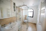 Bath Room, Drop In Sink, Enclosed Shower, Accent Lighting, One Piece Toilet, Travertine Floor, Stone Slab Wall, and Recessed Lighting  Photo 16 of 18 in Tree of Life by Natalia Beleva