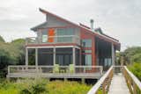 Exterior, Metal Siding Material, Shed RoofLine, Wood Siding Material, Metal Roof Material, and Beach House Building Type The Pawleys Island building inspector said that “the home blends without conforming.” The homeowner enjoys a view of the marsh and beach to the Atlantic Ocean.  Photo 2 of 12 in Sharp Home by Amber Allen