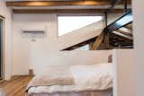 Loft bedroom space, showcasing new steel w-section mated to original ridge beam.