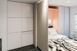 including a full-size Murphy bed, dining table, home office, wardrobe, various cubbies, and more.