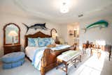 Bedroom, Ceiling Lighting, Dresser, and Bed  Photo 1 of 3 in Naples, Florida Condo by Bjorn Bauer Photography