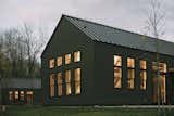 The three houses are oriented on the landscape above the Housatonic River. 
