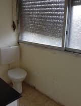The former bathroom and laundry room hid the best view behind rain glass windows.   Photo 3 of 11 in Budget Breakdown: A Gloomy Apartment in Israel Does a Full 180 for $115K