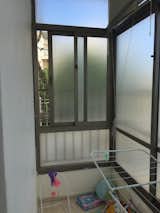 The enclosed balcony became integrated with the master bedroom.  Photo 7 of 11 in Budget Breakdown: A Gloomy Apartment in Israel Does a Full 180 for $115K